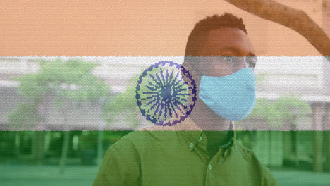 Komposition-Eines-Mannes-Mit-Gesichtsmaske-über-Der-Indischen-Flagge