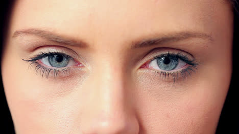 Brunette-opening-her-blue-eyes