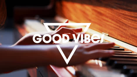Animation-of-good-vibes-text-over-child-playing-the-piano