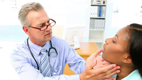 Doctor-checking-neck-glands-of-his-patient
