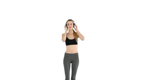 Fit-model-listening-to-music-and-dancing