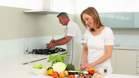 Mature-happy-couple-making-dinner-together