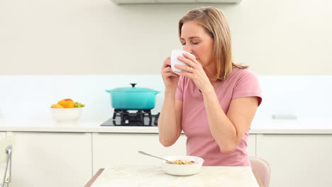 Mature-woman-drinking-coffee-at-breakfast