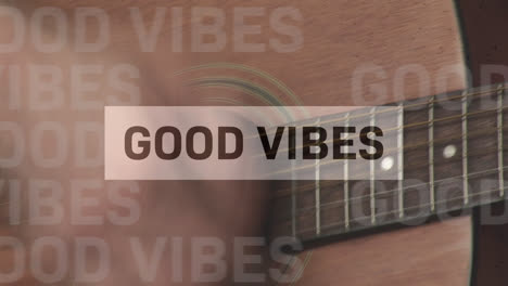 Animation-of-good-vibes-text-over-man-playing-the-guitar