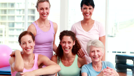 Smiling-group-of-women-in-fitness-studio