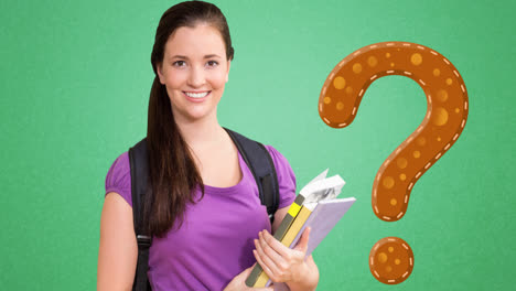 Animation-of-brown-question-mark-over-smiling-caucasian-female-student-holding-books,-on-green