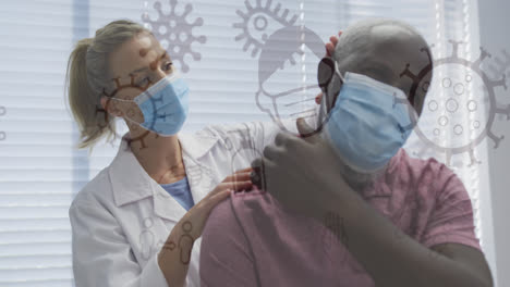 Animation-of-covid-19-cells-over-female-doctor-and-male-patient-in-face-masks