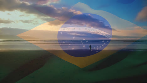Digitale-Komposition-Aus-Wehender-Brasilianischer-Flagge-Und-Mann,-Der-Am-Strand-Spazieren-Geht