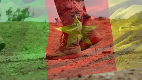 Animación-De-La-Bandera-De-Camerún-Ondeando-Sobre-La-Sección-Baja-De-Soldados-En-Marcha.