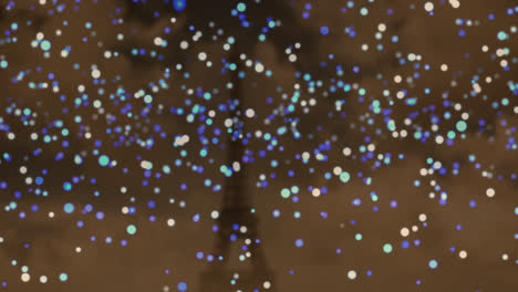 Animation-Von-Blau-weißen-Flackernden-Weihnachtsflecken-über-Dem-Eiffelturm-Im-Hintergrund