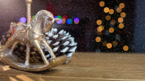 Animation-of-snow-falling-over-pine-cones-and-christmas-decoration