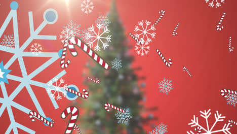 Animation-of-falling-snowflakes-and-candy-corns-over-christmas-tree
