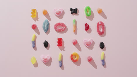 Video-of-colourful-jelly-candy-on-pink-background