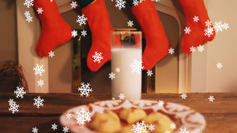 Animation-of-snow-falling-over-milk-and-cookies-at-christmas