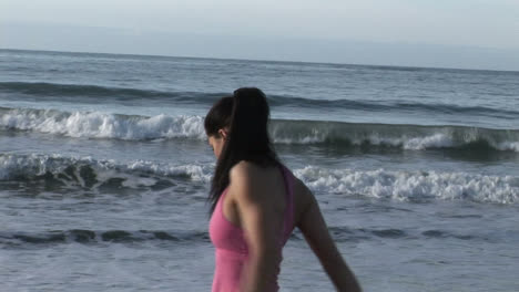 Woman-Stretching-on-Beach