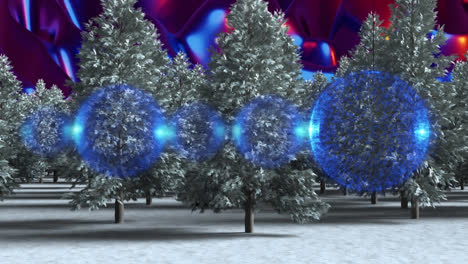 Blue-bauble-decorations-hanging-over-multiple-trees-on-winter-landscape-against-digital-waves