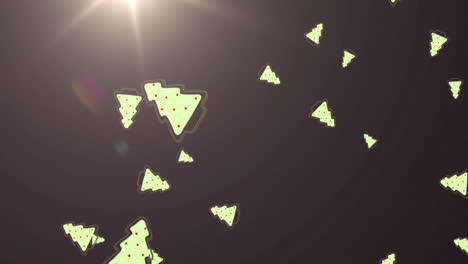 Multiple-christmas-tree-icons-falling-against-spot-of-light-on-grey-background