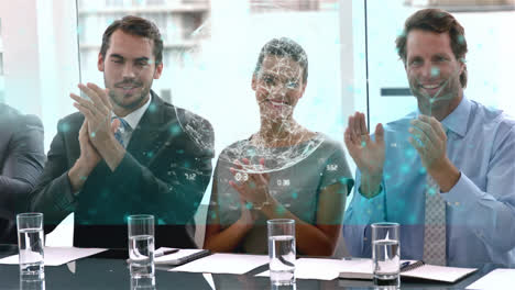 Animation-of-data-over-happy-diverse-male-and-female-business-colleagues-clapping-hands