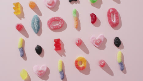 Video-of-colourful-jelly-candy-on-pink-background