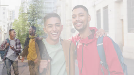 Composite-of-happy-mixed-race-male-friends-talking-in-street,-and-embracing-wearing-backpacks
