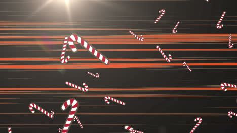 Animation-of-candy-cane-falling-over-glowing-rays-on-black-background