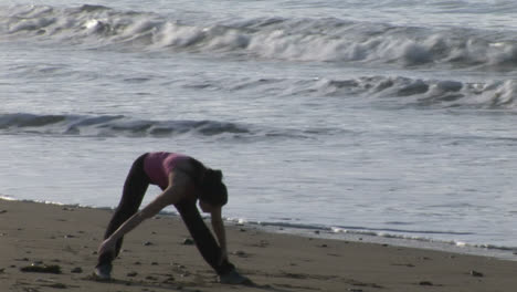 Woman-Stretching-on-Beach