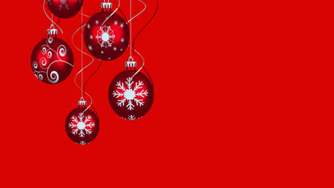 Animation-of-christmas-baubles-over-red-background