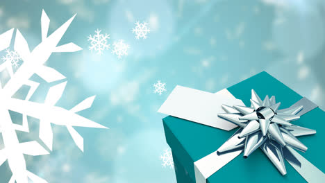 Animation-Von-Fallenden-Schneeflocken-über-Weihnachtsgeschenk-Und