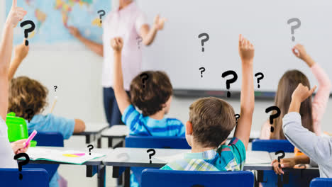 Animation-of-question-marks-over-diverse-elementary-school-teacher-and-class-raising-hands