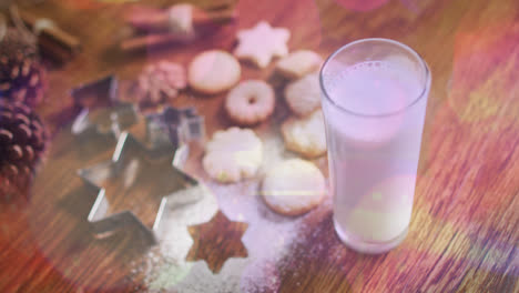 Animation-of-light-spots-over-milk-and-cookies-at-christmas