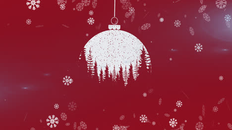Snowflakes-falling-over-christmas-bauble-decoration-hanging-against-red-background