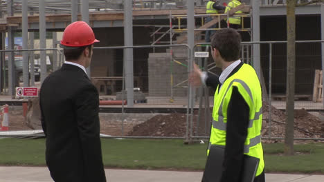 Two-engineers-in-discussion-at-a-Construction-Site