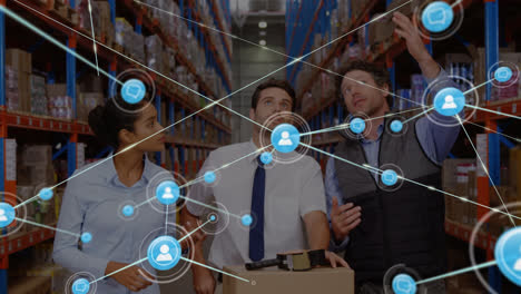 Animation-of-network-of-connected-people-icons-over-diverse-workers-in-warehouse