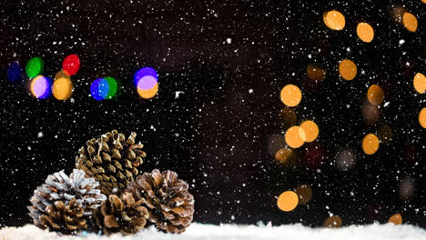 Animation-of-snow-falling-over-pine-cones-and-christmas-decoration