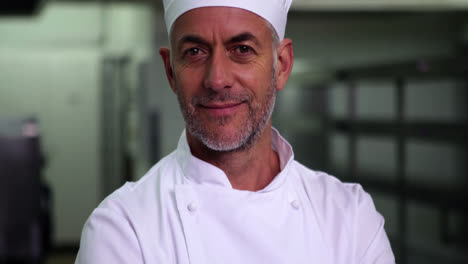 Head-chef-making-ok-sign-and-smiling-at-camera