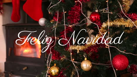 Animation-of-feliz-navidad-over-christmas-presents,-fireplace-and-tree