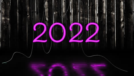 Animation-of-2022-text-in-pink-neon,-with-hanging-cables-on-black-background
