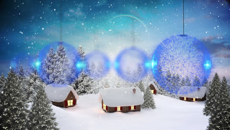 Animation-of-christmas-baubles-over-houses-in-winter-scenery