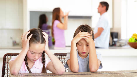 Sad-children-listening-to-their-parents-fighting