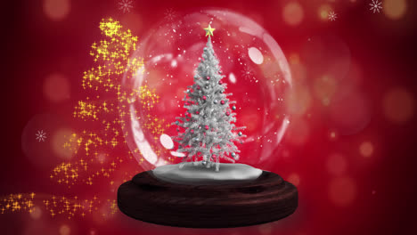 Estrella-Fugaz-Alrededor-De-Un-árbol-De-Navidad-En-Una-Bola-De-Nieve-Contra-Puntos-De-Luz-Sobre-Fondo-Rojo.