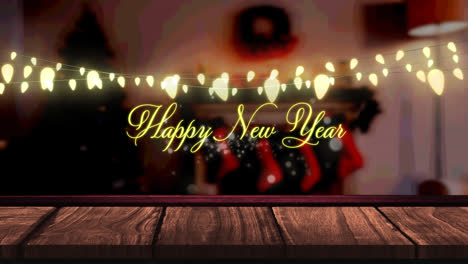 Happy-new-year-text-and-glowing-yellow-fairy-light-decoration-hanging-over-wooden-plank