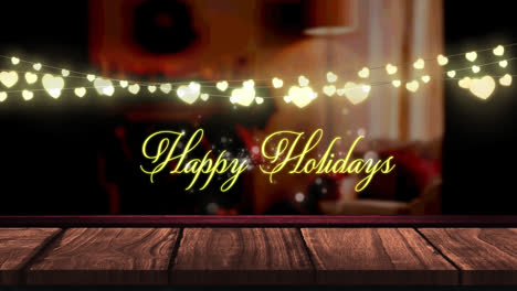 Animation-of-fairy-lights-and-happy-holidays-text-over-wooden-boards