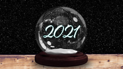 Animación-De-Nieve-Cayendo-Sobre-Una-Bola-De-Nieve-Con-Texto-De-2021-Sobre-Fondo-Negro