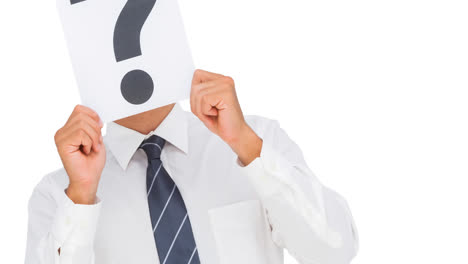 Caucasian-businessman-holding-question-mark-sign-over-face