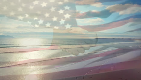 Digital-composition-of-waving-us-flag-over-businesspeople-shaking-hands-against-beach