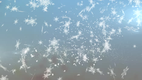 Digitale-Animation-Von-Schneeflocken,-Die-Vor-Einem-Lichtfleck-Auf-Blauem-Hintergrund-Fallen