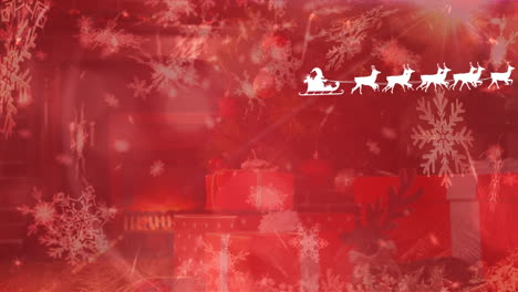 Animation-of-santa-claus-in-sleigh-with-reindeers-over-snow-falling-and-christmas-presents
