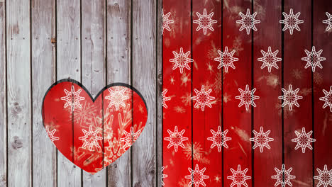 Animation-of-snowflakes-over-wooden-background