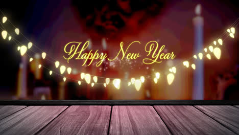 Animation-of-fairy-lights-and-happy-new-year-text-over-wooden-boards