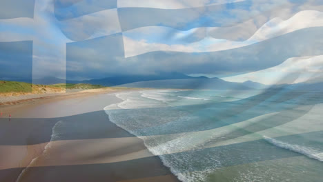 Digital-composition-of-waving-greece-flag-against-aerial-view-of-beach-and-sea-waves